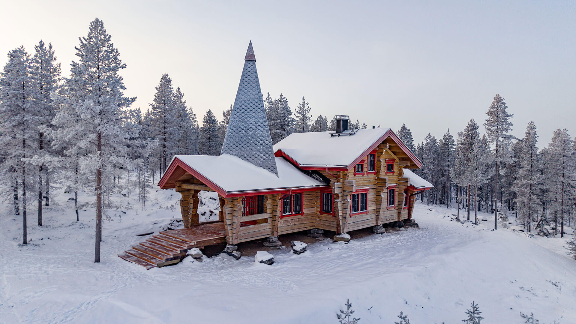 Santa Claus Cottage exterior in snowy landscape